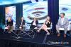 Panelists lead discussion on stage